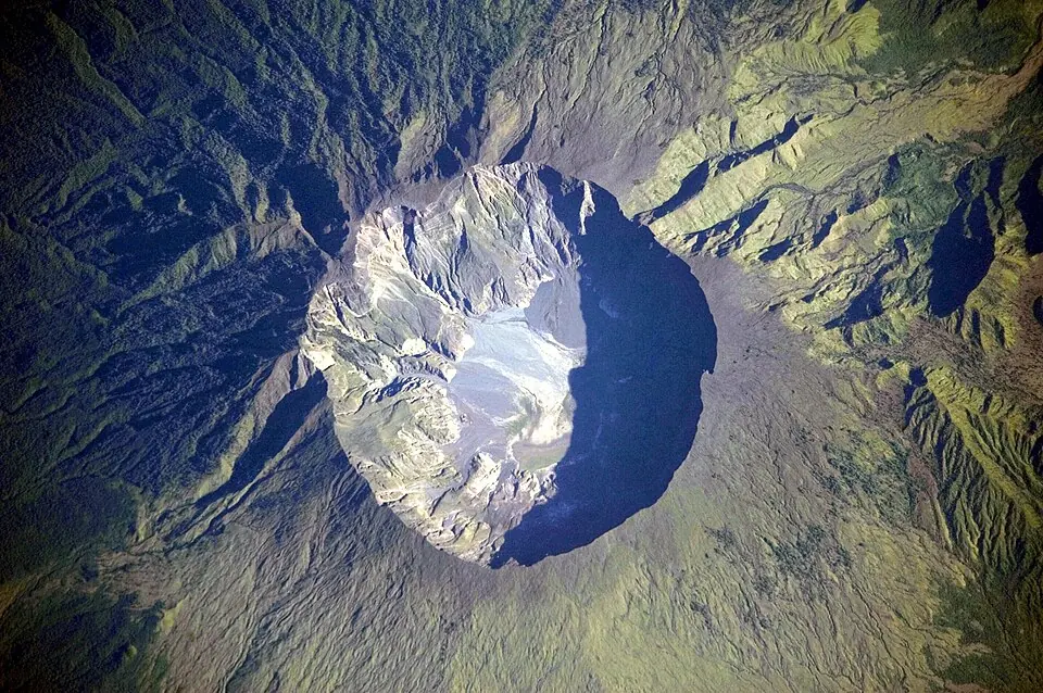 The summit caldera of Tambora, 6 kilometres across and 1,100 metres deep, photographed from the International Space Station in 2009. This basin formed in the eruption of 1815.